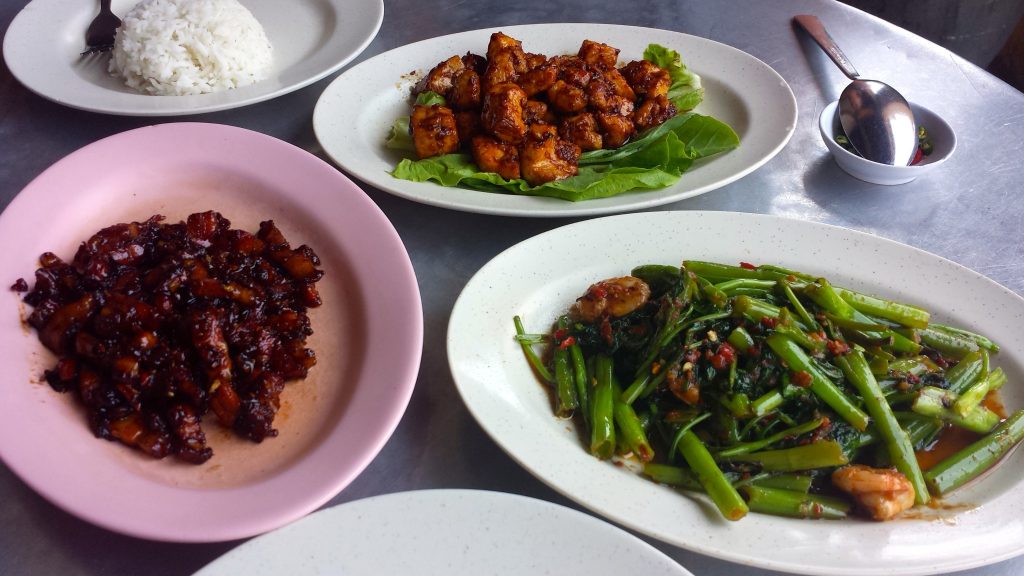 Chicken dish, pork dish, and greens at Tek Sen Chinese Restaurant