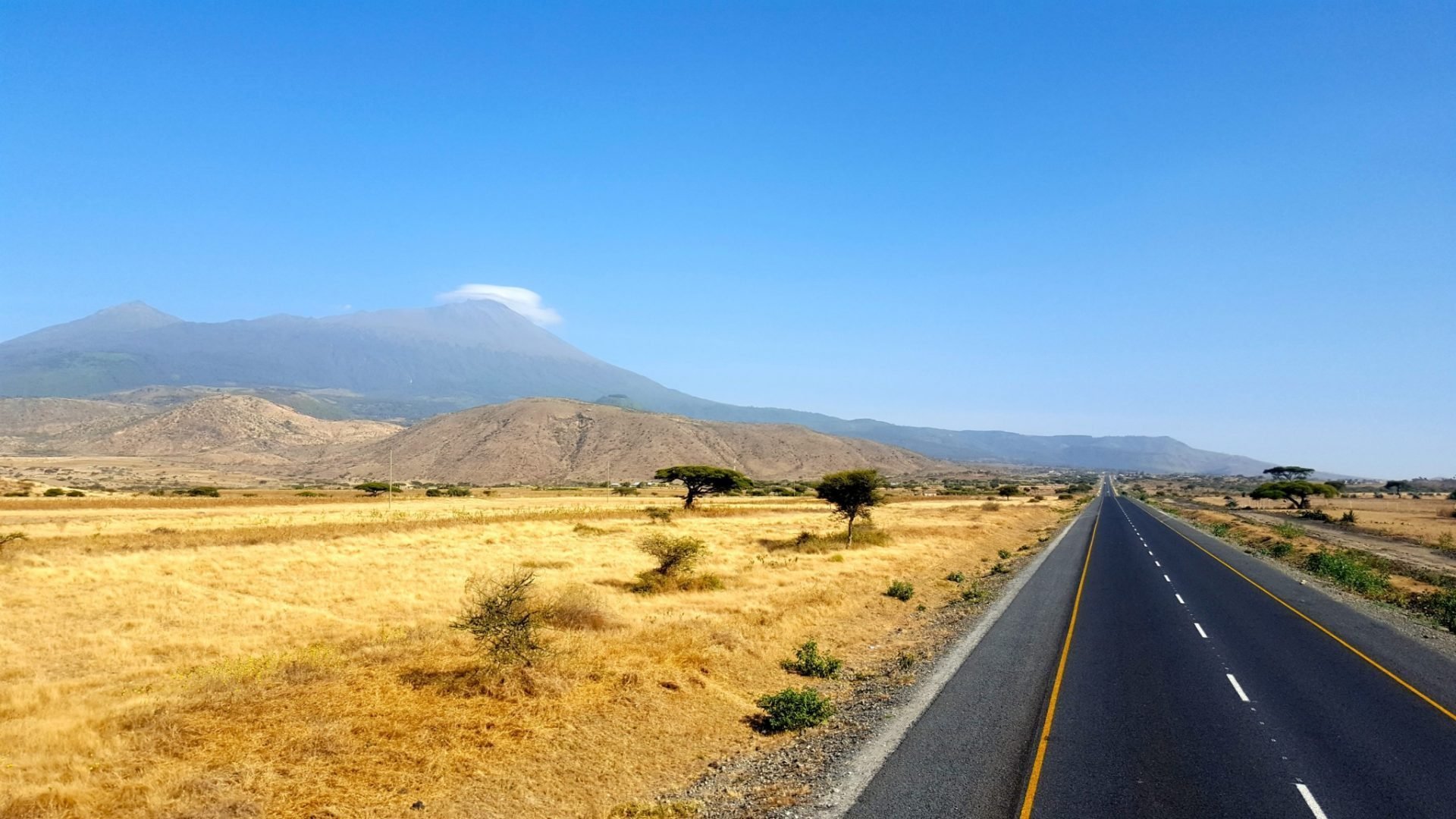 Road in Tanzania with Mount Meru in the background