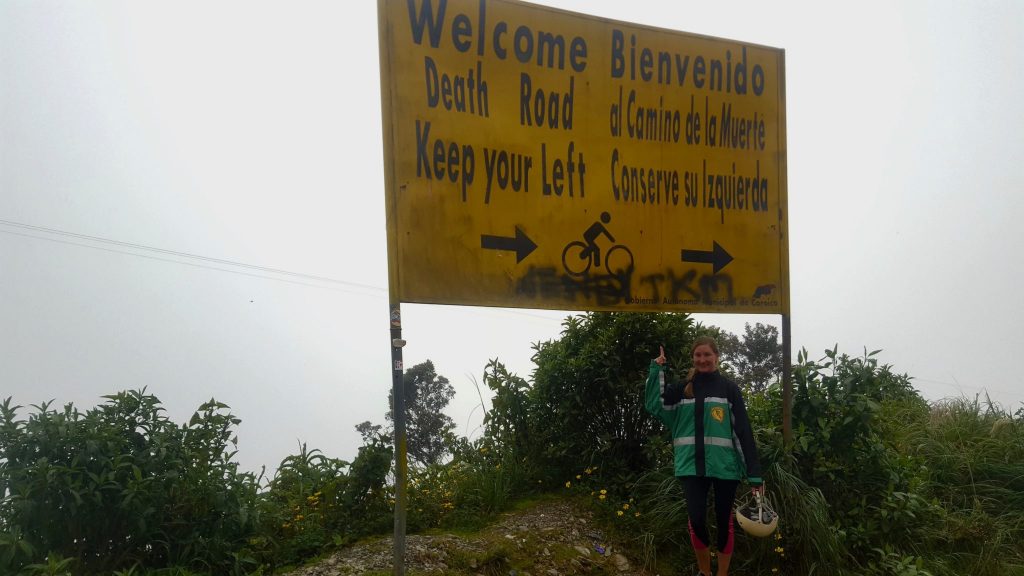 Heather standing in front of Death Road sign in Bolivia