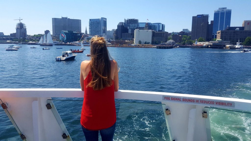 Looking at Halifax Waterfront from ferry is a fun thing to do in Halifax on a budget - only $2.50