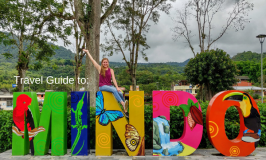 Mindo sign with title to post: Mindo Travel Guide